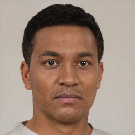 Neutral black young-adult male with short  brown hair and brown eyes