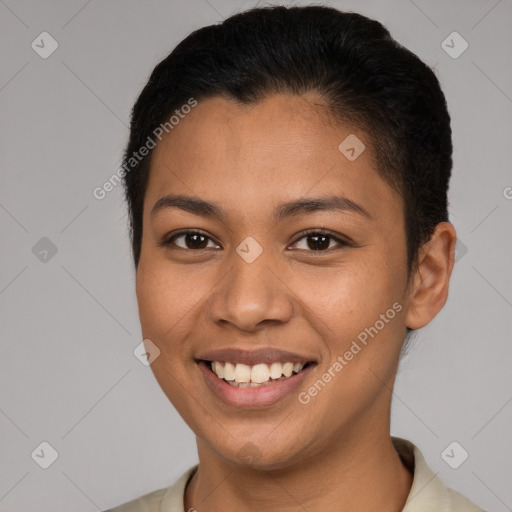 Joyful latino young-adult female with short  brown hair and brown eyes