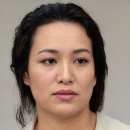 Neutral asian young-adult female with medium  brown hair and brown eyes