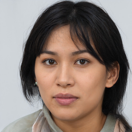 Neutral asian young-adult female with medium  brown hair and brown eyes