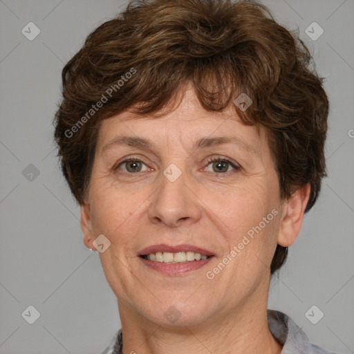 Joyful white adult female with short  brown hair and grey eyes