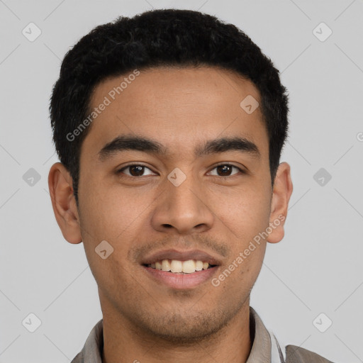 Joyful latino young-adult male with short  black hair and brown eyes