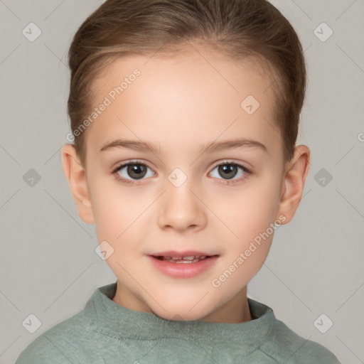 Joyful white child female with short  brown hair and brown eyes