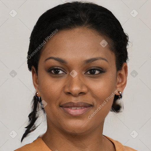 Joyful black young-adult female with short  black hair and brown eyes