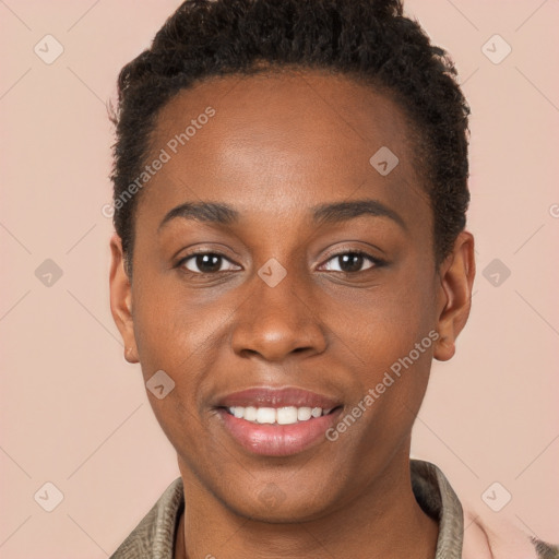 Joyful black young-adult female with short  brown hair and brown eyes