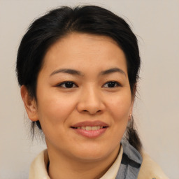 Joyful asian young-adult female with medium  brown hair and brown eyes