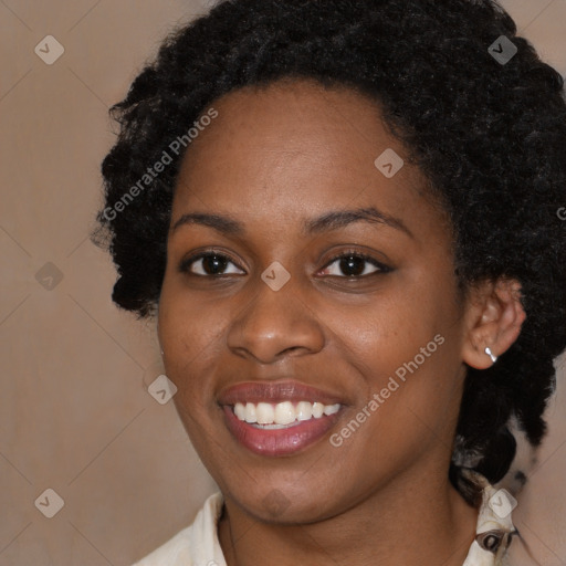 Joyful black young-adult female with medium  black hair and brown eyes