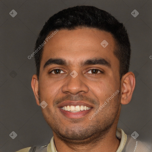 Joyful black young-adult male with short  black hair and brown eyes