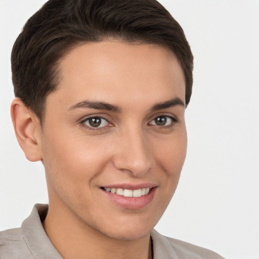 Joyful white young-adult female with short  brown hair and brown eyes