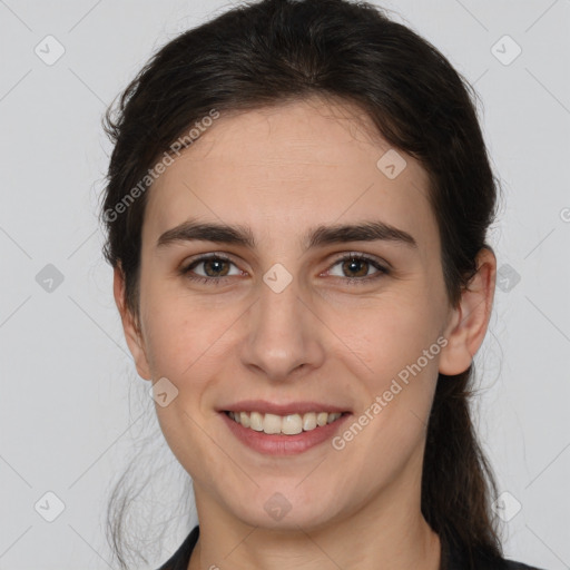 Joyful white young-adult female with medium  brown hair and brown eyes