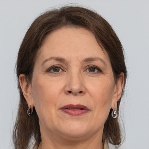 Joyful white adult female with medium  brown hair and grey eyes