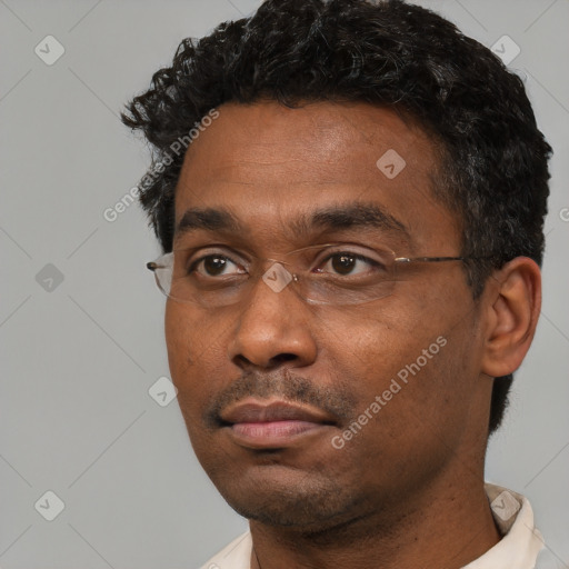 Neutral black young-adult male with short  black hair and brown eyes