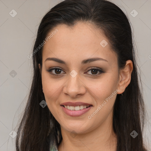 Joyful latino young-adult female with long  brown hair and brown eyes