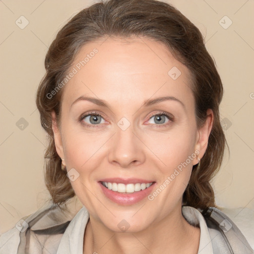 Joyful white young-adult female with medium  brown hair and blue eyes