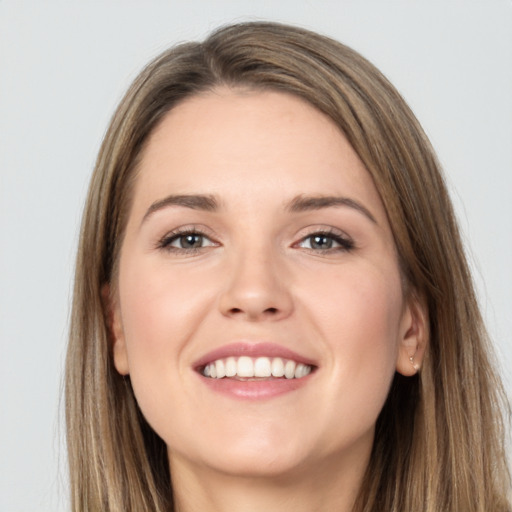 Joyful white young-adult female with long  brown hair and grey eyes