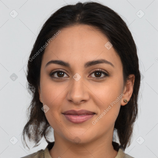 Joyful latino young-adult female with medium  brown hair and brown eyes