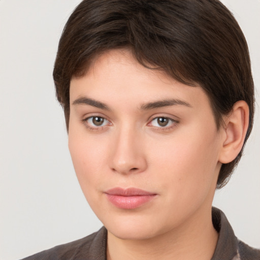 Neutral white young-adult female with short  brown hair and brown eyes