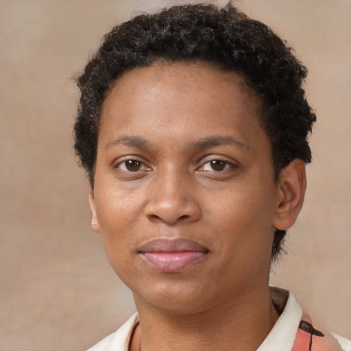 Joyful black adult female with short  black hair and brown eyes