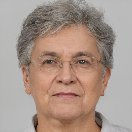 Joyful white middle-aged male with short  gray hair and brown eyes