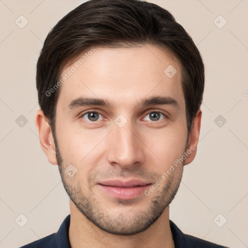 Joyful white young-adult male with short  brown hair and brown eyes