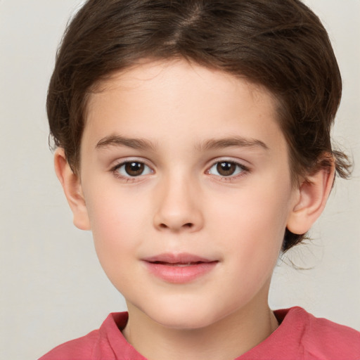 Joyful white child female with short  brown hair and brown eyes