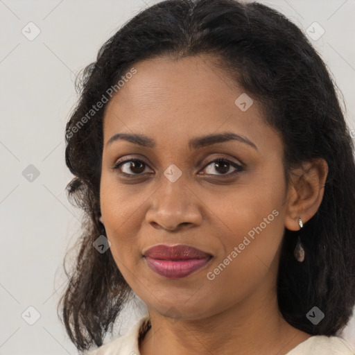 Joyful black young-adult female with medium  brown hair and brown eyes