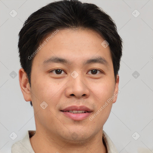 Joyful asian young-adult male with short  brown hair and brown eyes