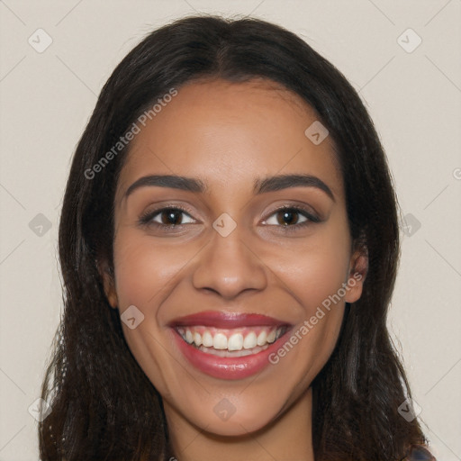 Joyful latino young-adult female with long  brown hair and brown eyes