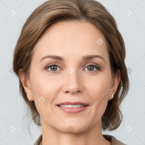 Joyful white adult female with medium  brown hair and grey eyes