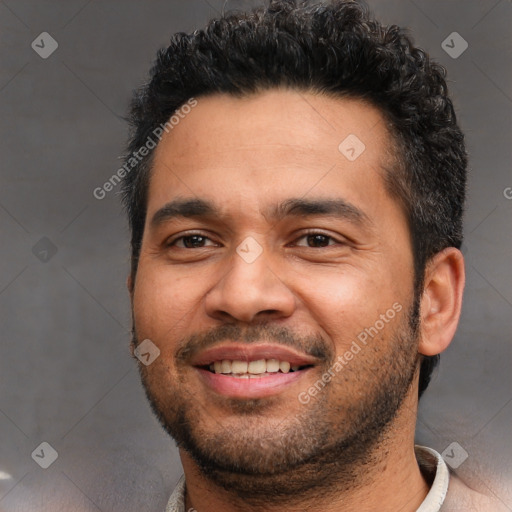 Joyful white young-adult male with short  black hair and brown eyes