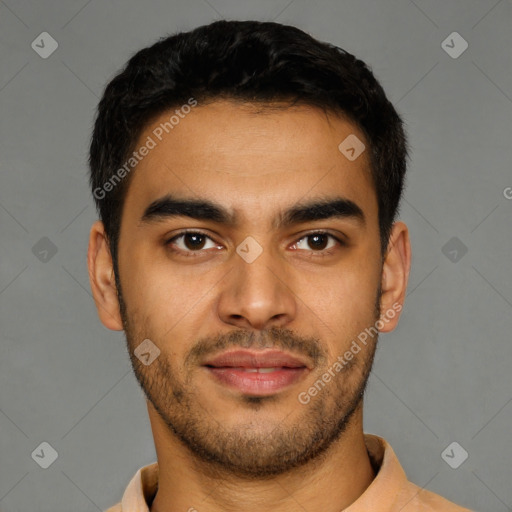 Joyful latino young-adult male with short  black hair and brown eyes