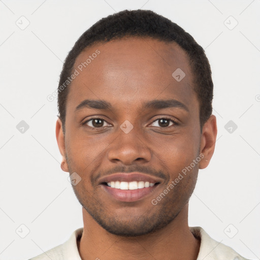 Joyful black young-adult male with short  brown hair and brown eyes