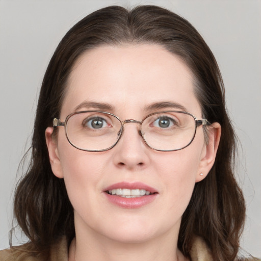 Joyful white young-adult female with long  brown hair and grey eyes