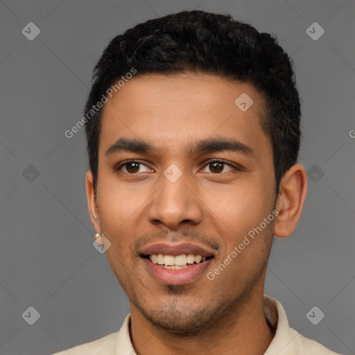 Joyful latino young-adult male with short  black hair and brown eyes