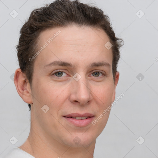 Joyful white adult female with short  brown hair and grey eyes