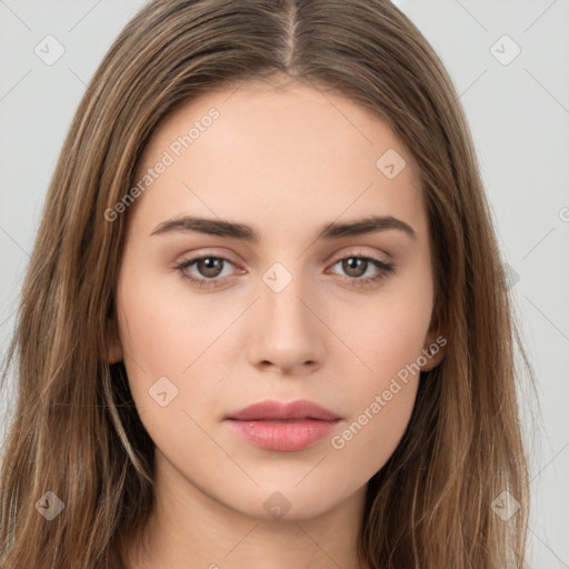 Neutral white young-adult female with long  brown hair and brown eyes