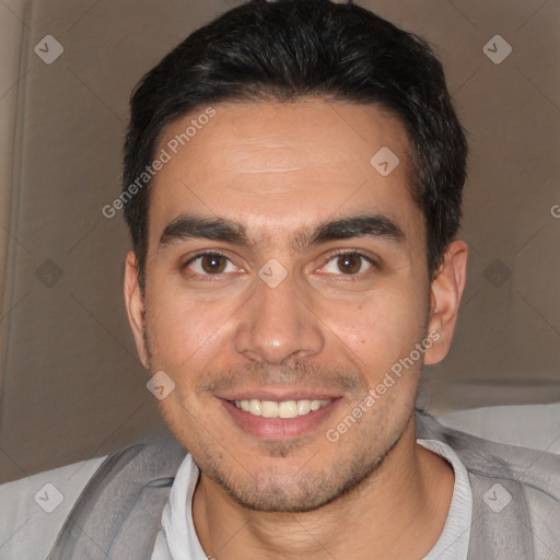 Joyful white young-adult male with short  black hair and brown eyes