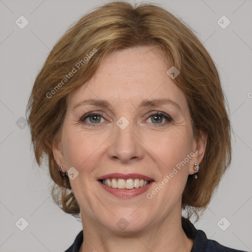 Joyful white adult female with medium  brown hair and grey eyes