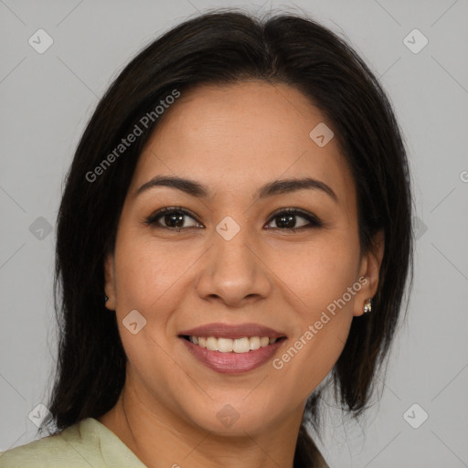 Joyful latino young-adult female with medium  brown hair and brown eyes