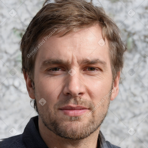 Joyful white adult male with short  brown hair and grey eyes