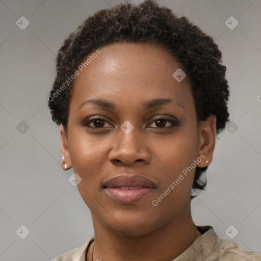 Joyful black young-adult female with short  brown hair and brown eyes