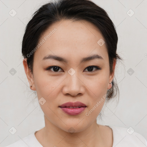 Joyful asian young-adult female with medium  brown hair and brown eyes