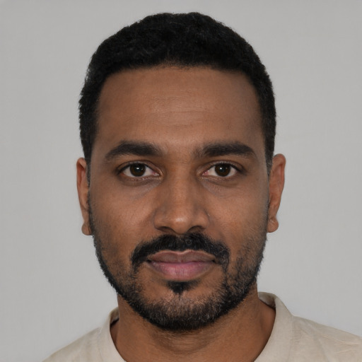 Neutral black young-adult male with short  black hair and brown eyes
