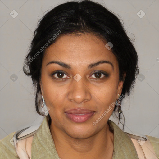 Joyful black adult female with medium  brown hair and brown eyes