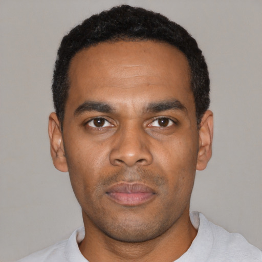 Neutral black young-adult male with short  black hair and brown eyes