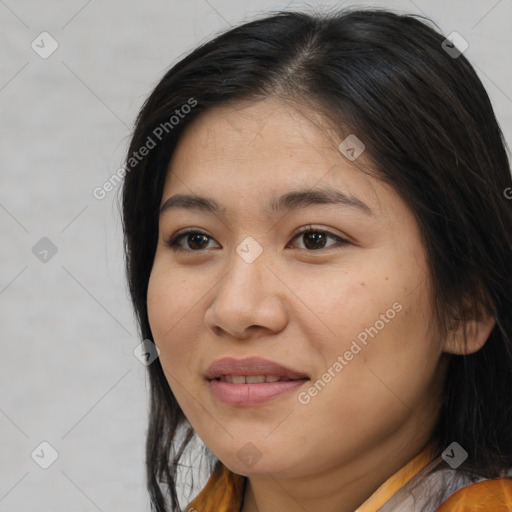 Joyful latino young-adult female with medium  brown hair and brown eyes