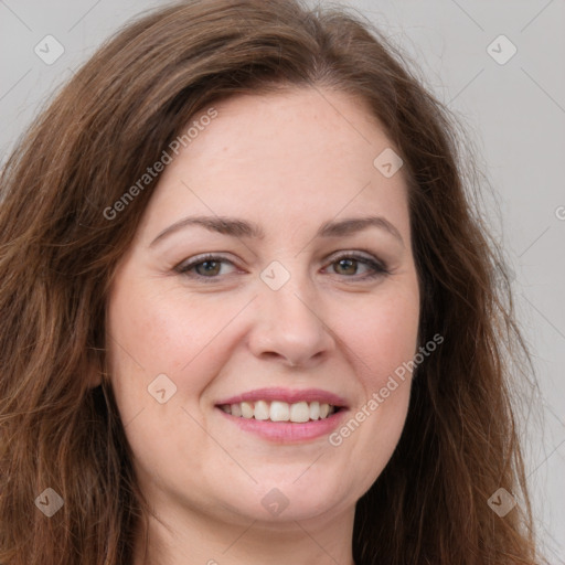 Joyful white young-adult female with long  brown hair and green eyes