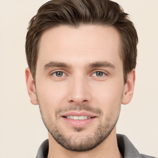 Joyful white young-adult male with short  brown hair and brown eyes