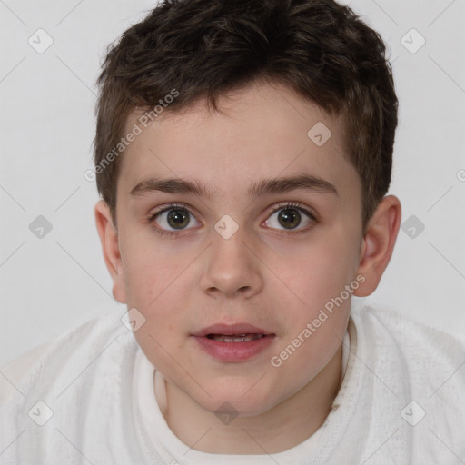 Joyful white child male with short  brown hair and brown eyes