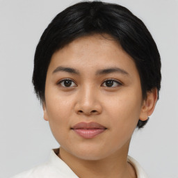 Joyful asian young-adult female with short  black hair and brown eyes